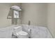 Cozy bathroom with a white toilet, neutral walls, and marble tile accents at 4381 W Flamingo Rd # 3809, Las Vegas, NV 89103