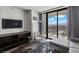 Bright sitting area features city views, comfortable seating, and a modern entertainment center at 4381 W Flamingo Rd # 3809, Las Vegas, NV 89103