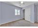 Bedroom with neutral carpet, window, ceiling fan, and closet at 4544 Velvet Oak Ct, Las Vegas, NV 89115
