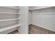Walk-in closet featuring built-in shelving and a hanging rod for optimal storage at 4544 Velvet Oak Ct, Las Vegas, NV 89115