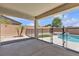 Back patio featuring pool, spa, and safety fence at 4544 Velvet Oak Ct, Las Vegas, NV 89115