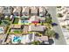 An aerial view that showcases a home with a pool, covered patio, artificial grass, and luscious landscaping at 4562 Sparwood Dr, Las Vegas, NV 89147