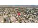 An aerial view of a vibrant neighborhood showcases the home's backyard pool and lush greenery at 4562 Sparwood Dr, Las Vegas, NV 89147