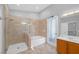 This bathroom features separate shower and tub and elegant tiling at 4562 Sparwood Dr, Las Vegas, NV 89147