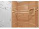 Bathroom showcasing a tiled shower with a built-in niche at 4562 Sparwood Dr, Las Vegas, NV 89147