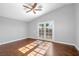This bedroom features a ceiling fan, access to a balcony and lots of natural light at 4562 Sparwood Dr, Las Vegas, NV 89147