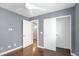 This bedroom features white trim and baseboards, ceiling fan and closet at 4562 Sparwood Dr, Las Vegas, NV 89147
