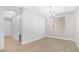 Bright dining room with wood-look tile flooring and a contemporary chandelier, ideal for Gathering meals at 4562 Sparwood Dr, Las Vegas, NV 89147