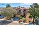 Beautiful two-story house featuring a well-maintained yard and a two car garage in a quiet neighborhood at 4562 Sparwood Dr, Las Vegas, NV 89147