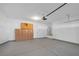 Spacious garage with ample storage cabinets and smooth concrete flooring at 4562 Sparwood Dr, Las Vegas, NV 89147