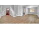 Spacious living room with beautiful wood-look tile flooring and plenty of natural light from the front windows at 4562 Sparwood Dr, Las Vegas, NV 89147