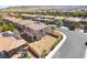 Expansive backyard of a single Gathering home with desert landscaping, a covered patio, solar panels, and mountain views at 512 Los Dolces St, Las Vegas, NV 89138