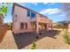 Back exterior with minimal landscaping, partially covered patio, and balcony at 512 Los Dolces St, Las Vegas, NV 89138