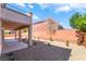 Backyard featuring low maintenance landscaping and covered patio at 512 Los Dolces St, Las Vegas, NV 89138