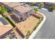 A spacious backyard features desert landscaping, a covered patio, and an elevated balcony at 512 Los Dolces St, Las Vegas, NV 89138