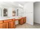 Bright bathroom boasts double vanity, spacious mirror, and tile flooring at 512 Los Dolces St, Las Vegas, NV 89138