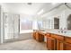 Bathroom featuring double vanity, soaking tub, and glass-enclosed shower at 512 Los Dolces St, Las Vegas, NV 89138