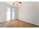 Bright bedroom with a ceiling fan, carpet, and French doors leading to the outside at 512 Los Dolces St, Las Vegas, NV 89138