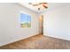 Bedroom featuring carpet, a window, and a ceiling fan with light at 512 Los Dolces St, Las Vegas, NV 89138