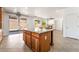 Kitchen island with granite counters, in an open floor plan, with access to backyard at 512 Los Dolces St, Las Vegas, NV 89138