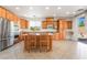Spacious kitchen boasts stainless steel appliances and a central island with seating at 512 Los Dolces St, Las Vegas, NV 89138