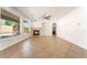 Bright living room features large windows, a ceiling fan, and a cozy fireplace at 512 Los Dolces St, Las Vegas, NV 89138