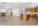 Large open space with kitchen, living room and a fireplace and large windows at 512 Los Dolces St, Las Vegas, NV 89138