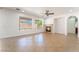 Bright living room showcasing tile flooring, natural light, a fireplace and seamless archways at 512 Los Dolces St, Las Vegas, NV 89138