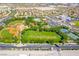 Aerial view of a neighborhood park with baseball fields, grassy areas, and recreational facilities at 512 Los Dolces St, Las Vegas, NV 89138