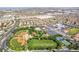 Overhead view of a community park with baseball fields, green spaces, and parking lots at 512 Los Dolces St, Las Vegas, NV 89138