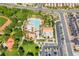 Aerial photo shows a community pool, clubhouse and lush green landscaping, a perfect recreational area at 512 Los Dolces St, Las Vegas, NV 89138