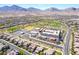 An aerial captures a well-maintained school complex in a planned community with mountain views at 512 Los Dolces St, Las Vegas, NV 89138