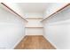 Empty walk-in closet with ample shelving and neutral carpet at 512 Los Dolces St, Las Vegas, NV 89138