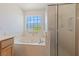 Bathroom featuring a soaking tub and a separate shower at 5232 Saranac Rd, Las Vegas, NV 89130