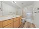 Bright bathroom featuring wood-style floors and updated fixtures at 5232 Saranac Rd, Las Vegas, NV 89130