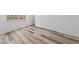 Cozy bedroom featuring wood-style floors and natural light at 5232 Saranac Rd, Las Vegas, NV 89130