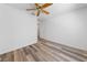 Bedroom with wood-look flooring, ceiling fan, and closet at 5232 Saranac Rd, Las Vegas, NV 89130