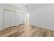 Bedroom with wood-look flooring, ceiling fan, and closet at 5232 Saranac Rd, Las Vegas, NV 89130
