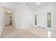 Bright entryway with white tile flooring, decorative glass blocks, and access to adjacent rooms at 5232 Saranac Rd, Las Vegas, NV 89130