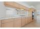 Kitchen with tile countertops, wood cabinets, double oven and pass-through window to the living space at 5232 Saranac Rd, Las Vegas, NV 89130