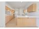 Kitchen with tiled countertops, wood cabinets, and a breakfast bar at 5232 Saranac Rd, Las Vegas, NV 89130