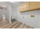 Functional laundry room equipped with a utility sink and cabinetry at 5232 Saranac Rd, Las Vegas, NV 89130
