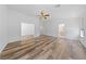 Bright living room featuring wood-style floors and a ceiling fan at 5232 Saranac Rd, Las Vegas, NV 89130