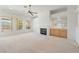 Open living room with built-in bar, fireplace, and large windows offering abundant natural light at 5232 Saranac Rd, Las Vegas, NV 89130