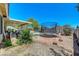 Backyard area featuring a trampoline, covered patio, and desert-style landscaping at 5236 Krista Alethea St, North Las Vegas, NV 89031