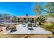 Spacious backyard with patio, trampoline, and desert landscaping perfect for outdoor enjoyment at 5236 Krista Alethea St, North Las Vegas, NV 89031