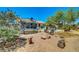 Backyard featuring a trampoline, seating area, and natural desert landscape at 5236 Krista Alethea St, North Las Vegas, NV 89031