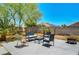 Backyard patio with contemporary seating and desert landscaping under the sun at 5236 Krista Alethea St, North Las Vegas, NV 89031