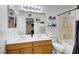 Well-appointed bathroom featuring double sinks, a shower-tub combo, and ample storage at 5236 Krista Alethea St, North Las Vegas, NV 89031