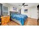 Cozy bedroom with wood floors, natural light, and a comfortable, well-styled bed at 5236 Krista Alethea St, North Las Vegas, NV 89031